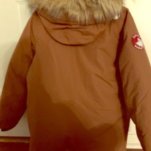 A tan/brown “CANADA WEATHER GEAR” winter coat!!!